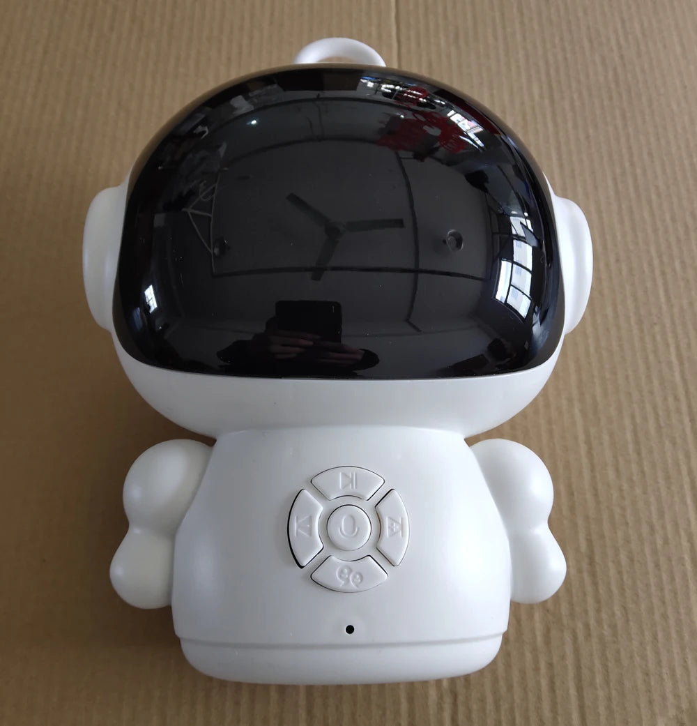 White plastic robot toy with black face shield and control buttons, an interactive educational robot for kids learning.