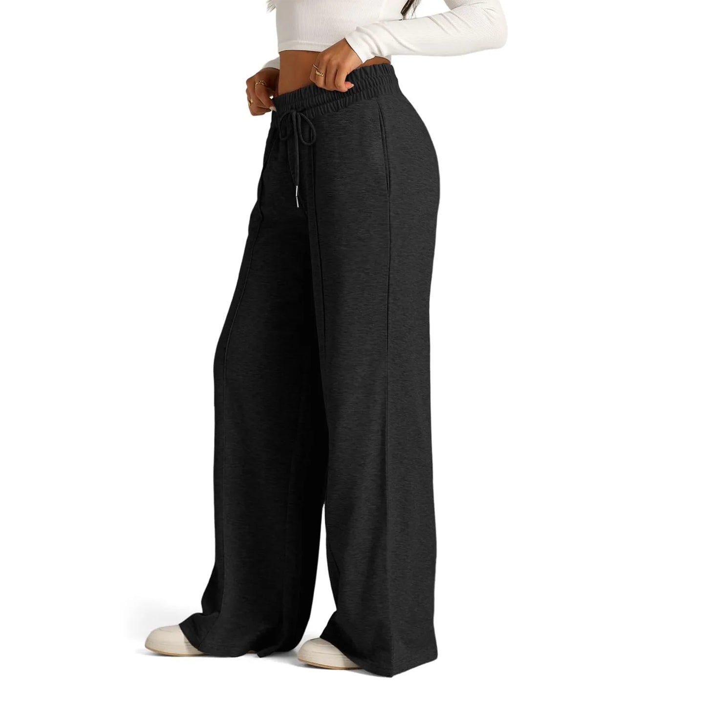 Charcoal high waist fleece-lined flowy wide leg pants with a drawstring, worn for comfort in cold weather.