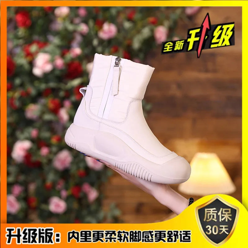 Off-white waterproof short winter boot featuring a side zipper, quilted upper, and thick, ridged platform sole.