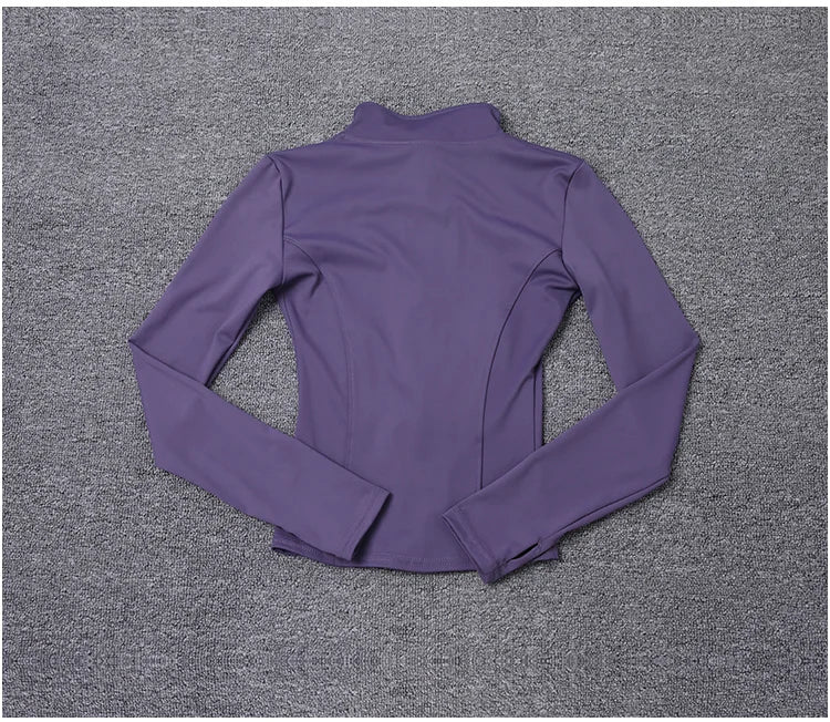 Purple long sleeve polyester sport jacket with a fitted design for gym training and yoga.