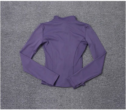 Purple long sleeve polyester sport jacket with a fitted design for gym training and yoga.