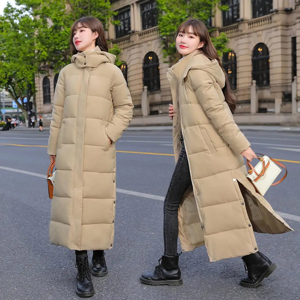 Women's long hooded coat with zip closure and side slits