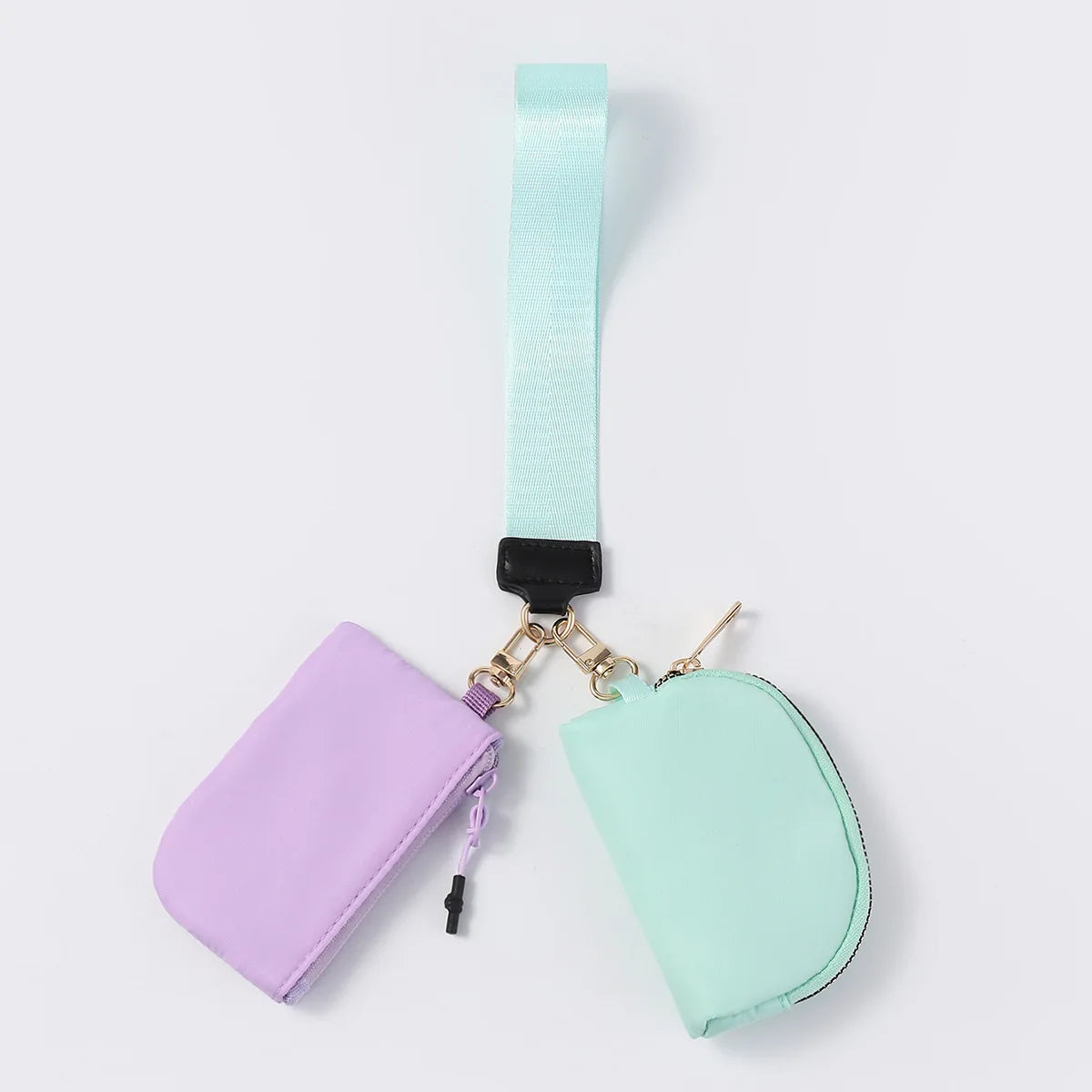 Purple and mint nylon dual pouch wristlet wallet with zip closure for daily essentials.