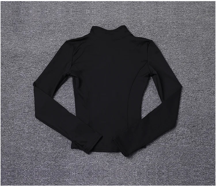 Black long sleeve polyester sport jacket with a fitted, sculpting design for gym training and yoga.