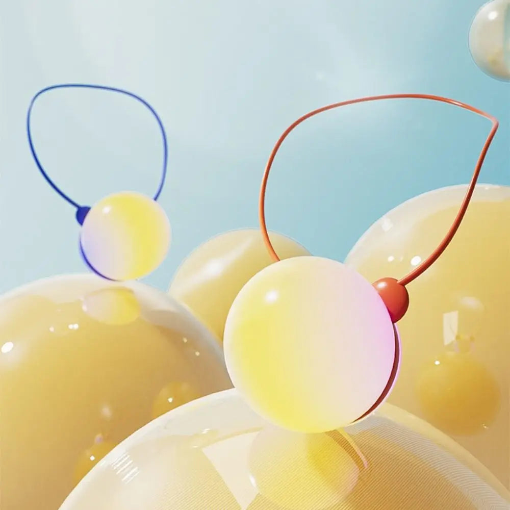 Yellow plastic spheres with conversation-ready loops are an interactive language learning robot toy for child education.