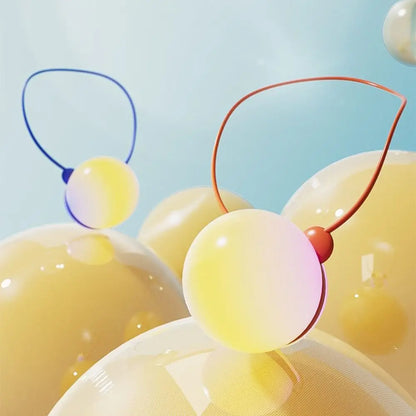 Yellow plastic spheres with conversation-ready loops are an interactive language learning robot toy for child education.