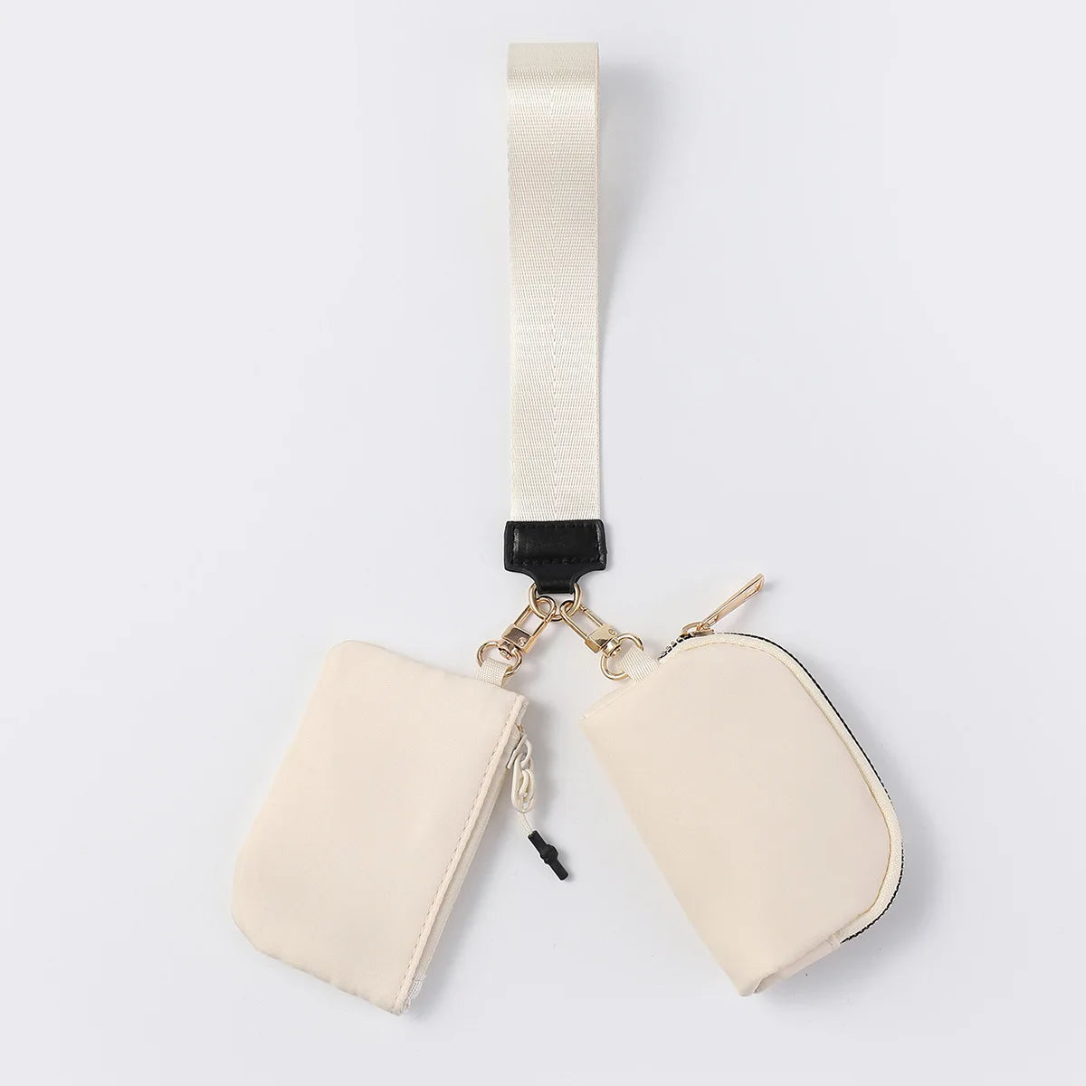 Beige nylon dual pouch wristlet wallet with zip closure for carrying cards, coins, and keys on the go.