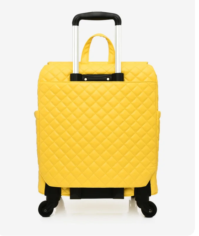 Bright yellow quilted rolling suitcase with a top handle, retractable pull handle, and black wheels.