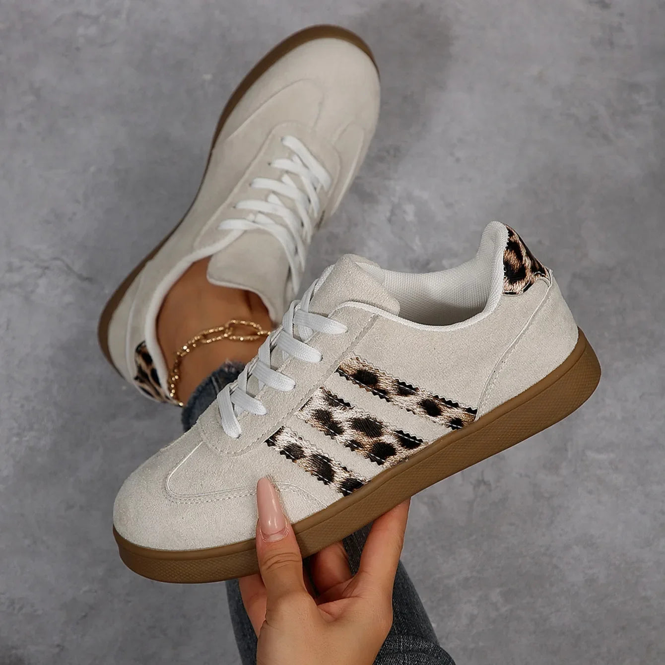 Beige suede lace-up sneakers with leopard print stripes and a gum sole, cushioned slip-on shoes for daily outdoor wear.