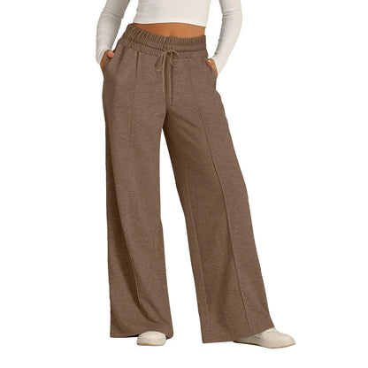 Brown high waist flowy pants with a drawstring and fleece lining for comfortable all-day wear.