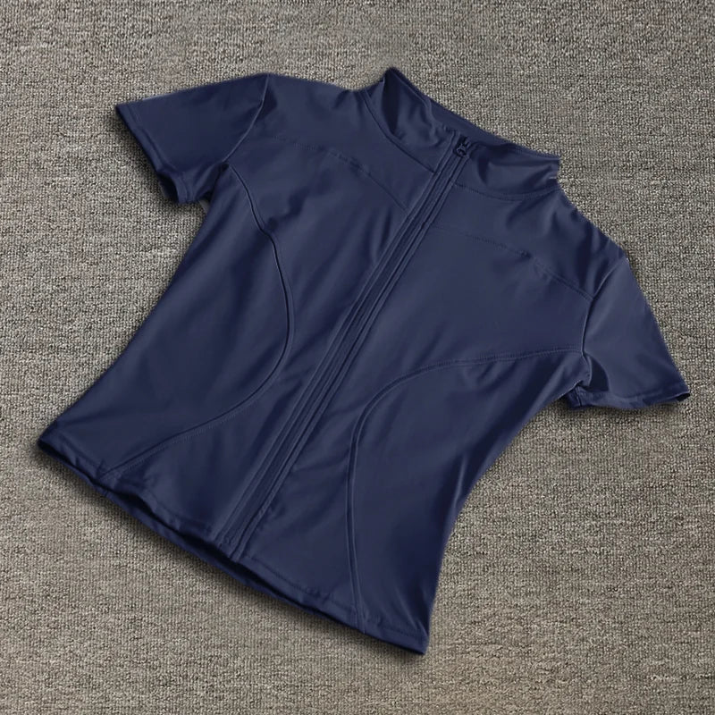 Navy blue short-sleeve sculpting training top with a full-zip front and stand collar for yoga workouts.