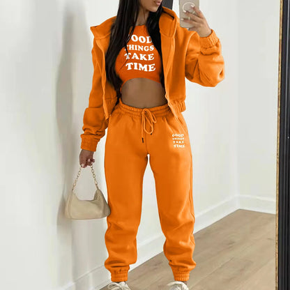 Bright orange relaxed knit sweater set with white letter print for lounging or casual daily wear.