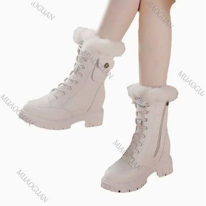 White lace-up snow boots with faux fur trim, platform heel, and side zipper.