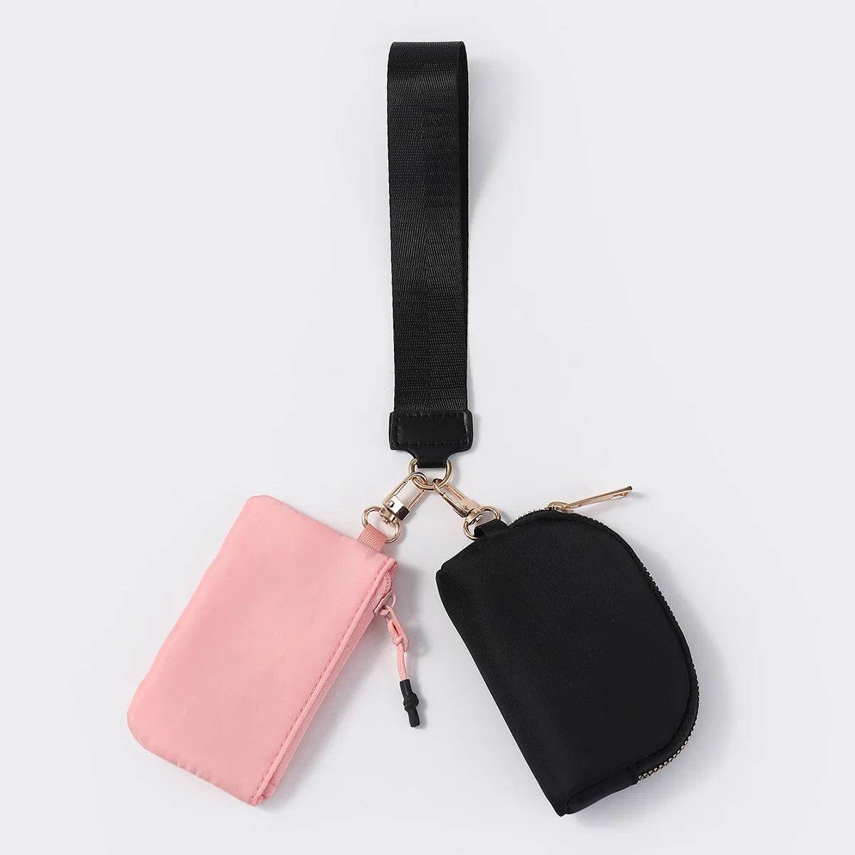 Pink and black nylon dual pouch with a wrist strap and zip closure for carrying cards, coins, and keys.