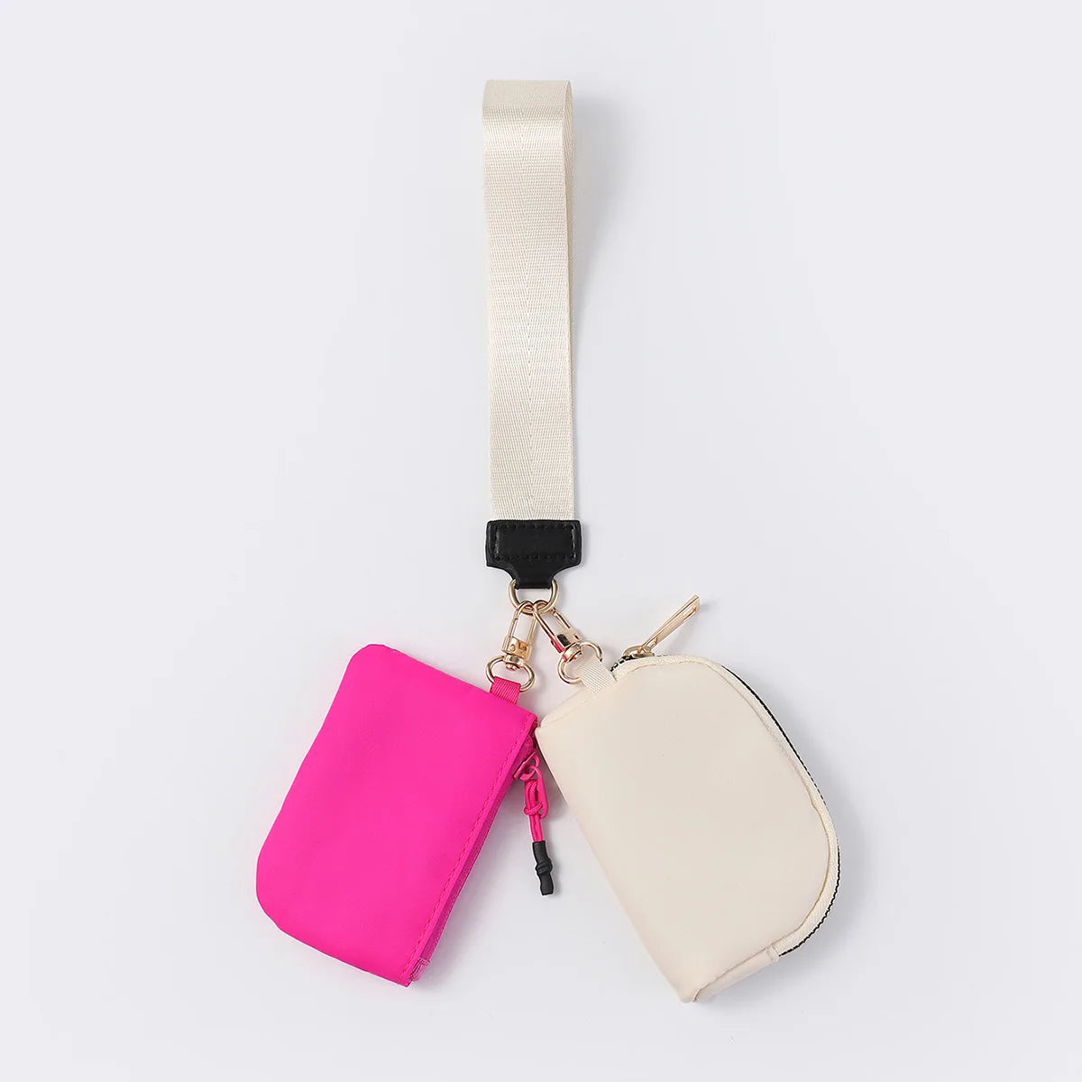Pink and cream nylon dual pouch wristlet wallet with a zip closure for carrying cards, coins, and keys on the go.