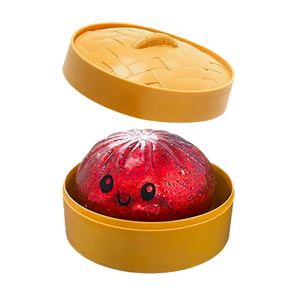 Red smiley dumpling in a tan woven steamer basket, a soft squishy fidget toy for sensory play and stress relief.