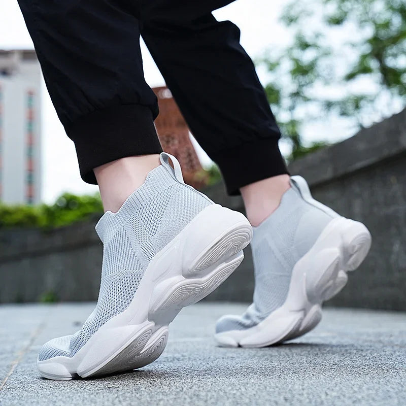 Light grey knit slip-on moccasin sneaker with a white platform sole for daily casual wear.