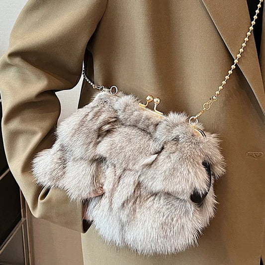 Shoulder bag with faux fur texture and metal clasp chain strap
