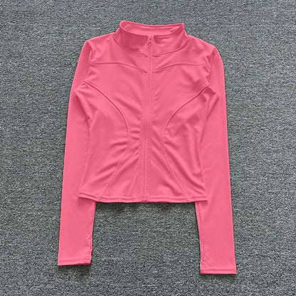 Pink long-sleeve fitted sport jacket with zip closure for gym training and yoga.