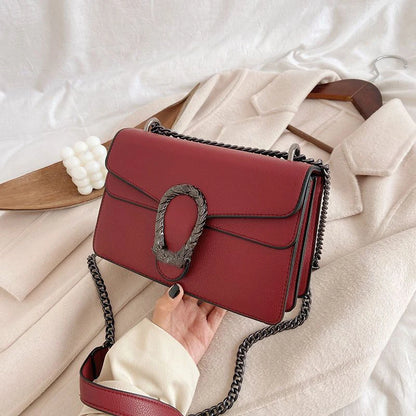 Textured Leather Crossbody Bag With Crocodile Pattern And Durable Build And Everyday Chain Strap