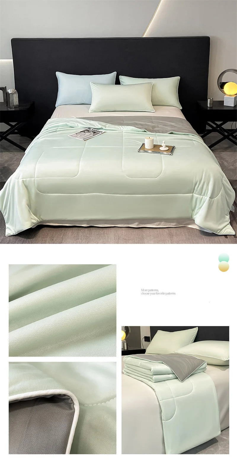 Light green, reversible cooling comforter with smooth, moisture-wicking bedding fabric for a comfortable night's sleep.