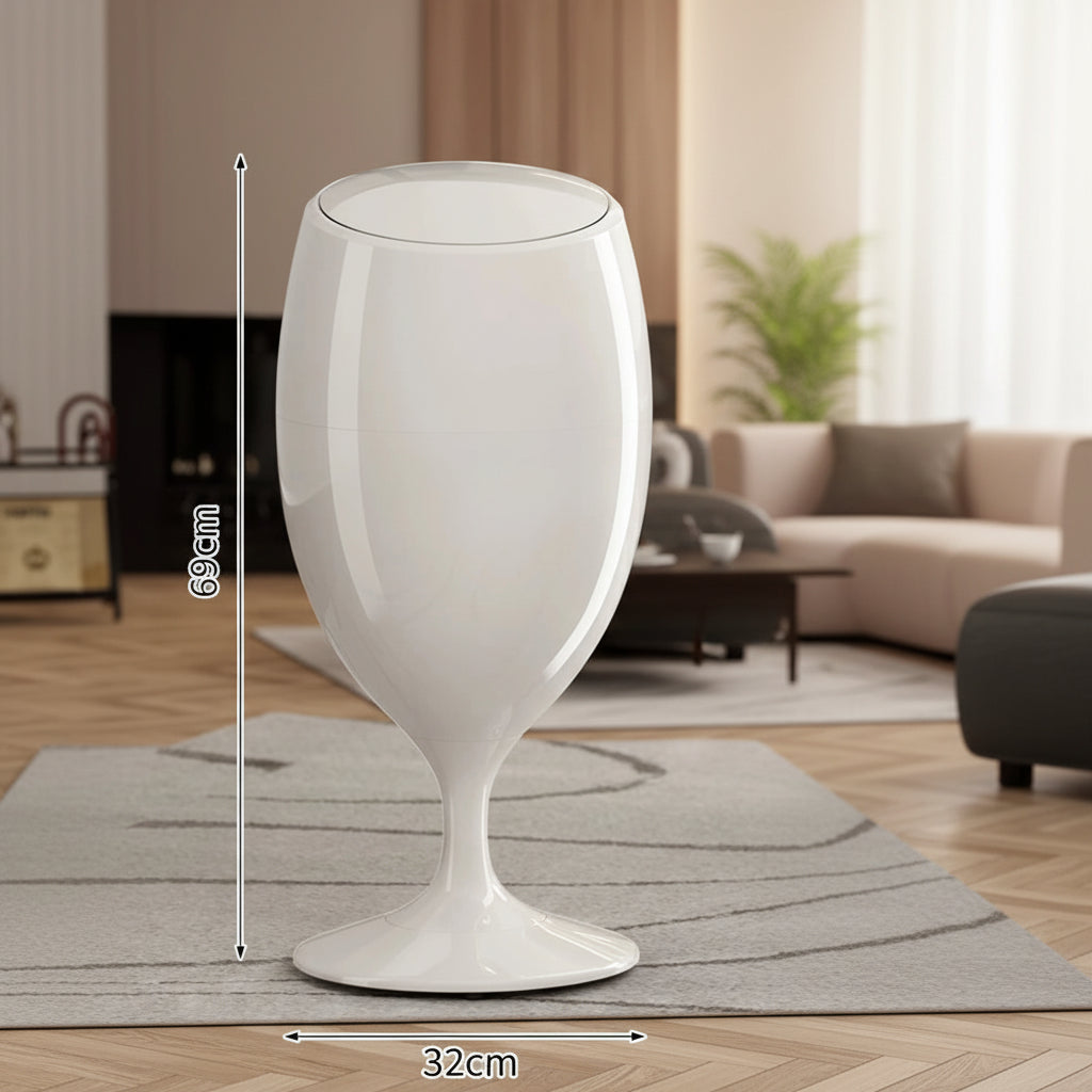 White wine glass-shaped trash can with dimensions, 69cm tall and 32cm wide, on a rug.