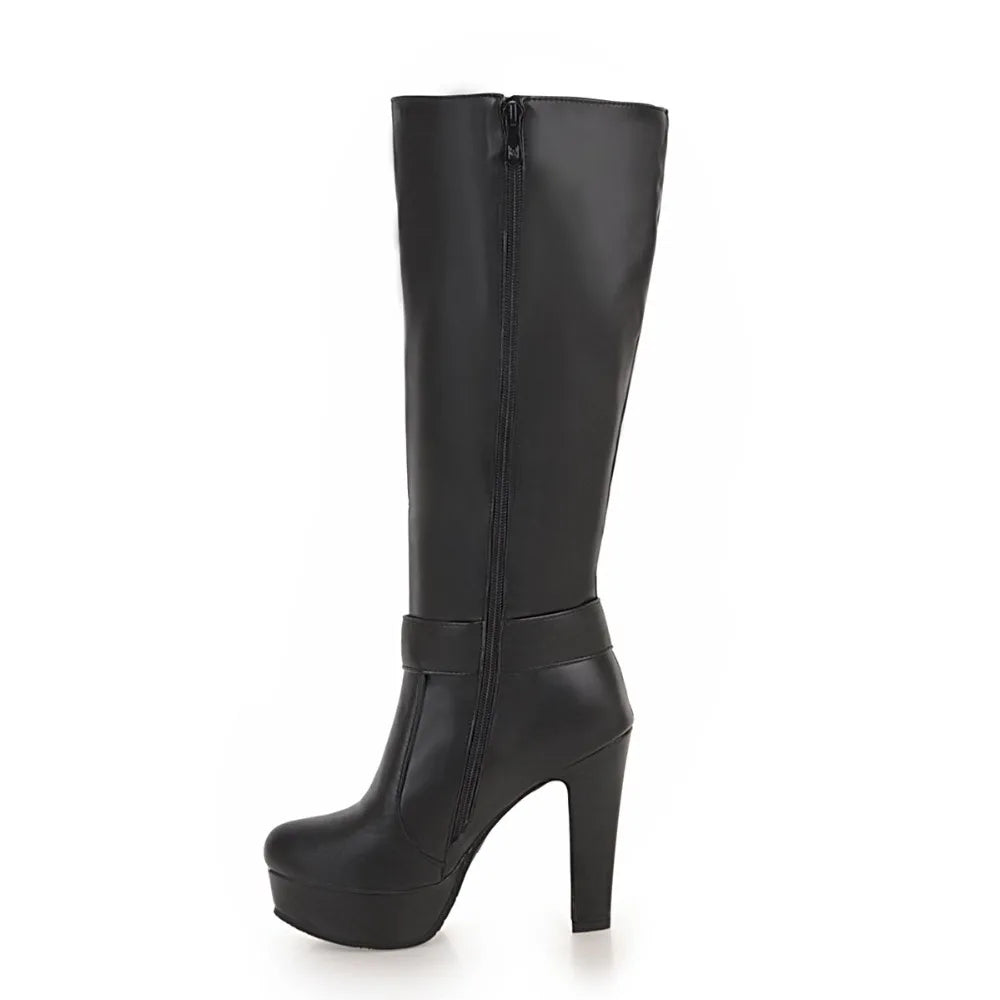 Black knee-high platform boot with high heel, side zipper, and ankle strap.