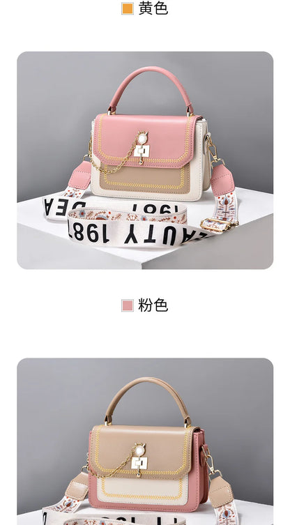 Two color-blocked leather handbags with top handles, gold hardware, decorative chain charms, and wide branded straps.