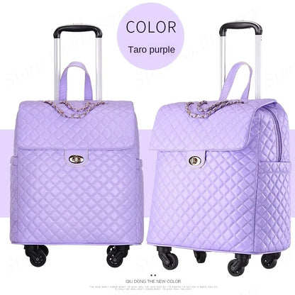 Taro purple quilted PU retro rolling luggage with a top handle, turn-lock flap, chain detail, and wheels.