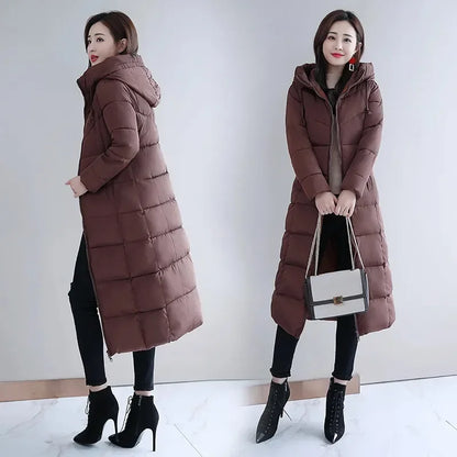 Brown long quilted puffer coat for women, featuring a hooded design, zip closure, and knee-length hemline.
