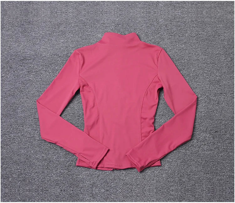 Pink long-sleeve polyester fitted sport jacket with a mock neck, ideal for gym training and yoga.