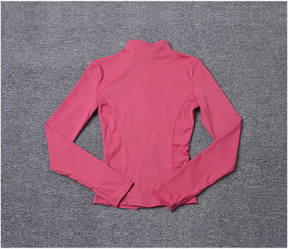 Pink long-sleeve polyester fitted sport jacket with a mock neck, ideal for gym training and yoga.