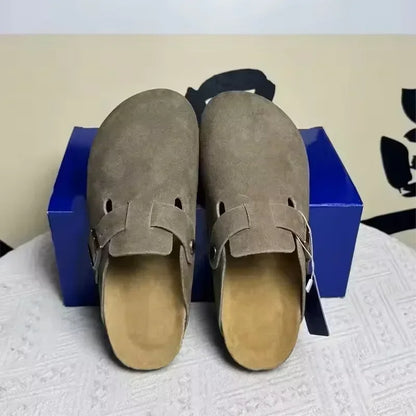 Taupe suede slip-on non-slip mules with buckle detail for beach wear.