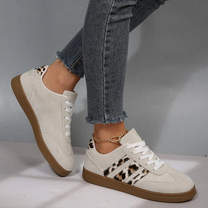 Beige suede low heel sneakers with leopard print side stripes and cushioned insoles for outdoor walking.