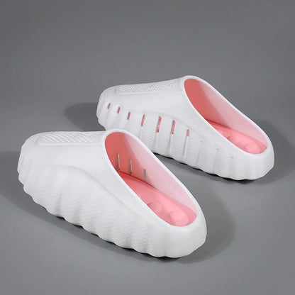 White, slip-on platform sandals with pink cushioned insoles and textured, vented sides for comfortable daily wear.