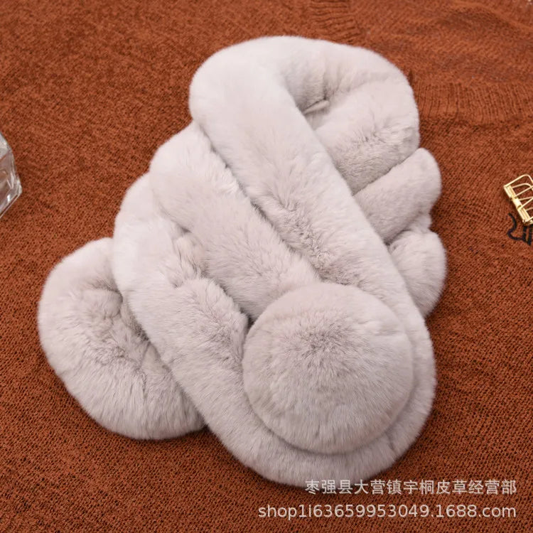 Light gray rabbit fur scarf with a triple-tube design and a pom-pom accent.