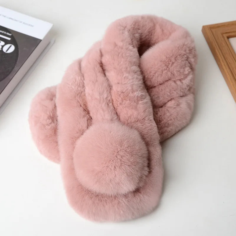 Pink plush rabbit fur winter scarf with a pom-pom detail.
