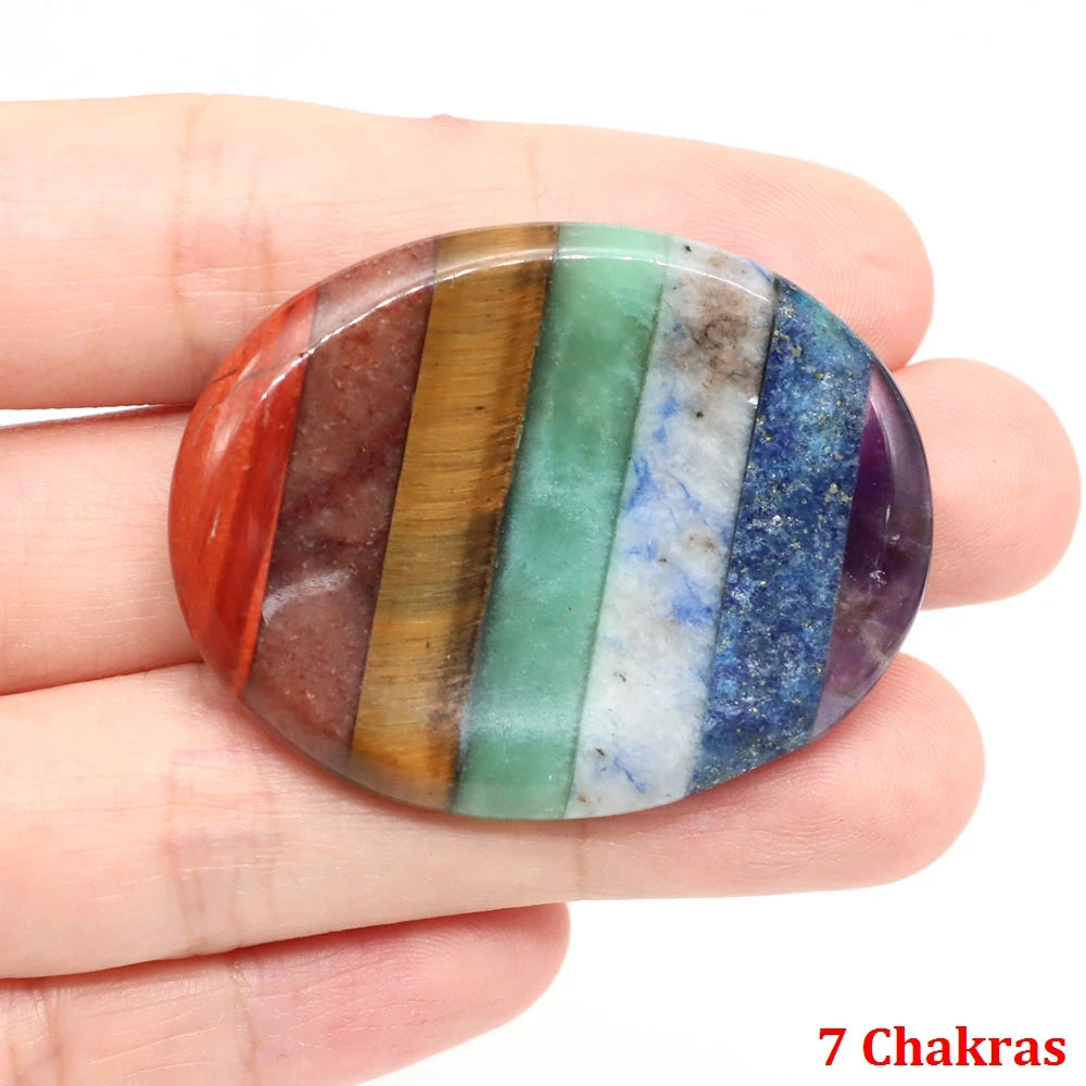 Polished, oval multicolored gemstone for meditation home decor, featuring seven vertical stripes of natural stone.