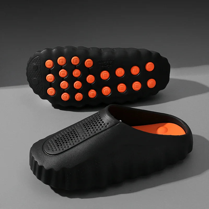 Black EVA slip-on shoes with orange massage soles and non-slip tread for daily wear.