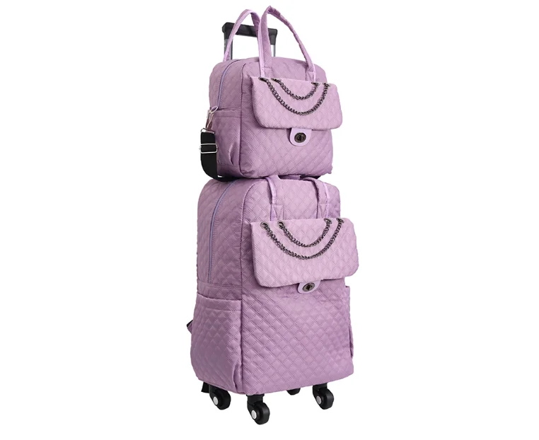 Light purple quilted rolling backpack and matching handbag set with chain accents and dual wheels.