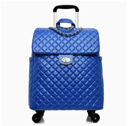 Blue quilted leather rolling suitcase with a front flap, gold turn-lock, chain detail, and telescoping handle.