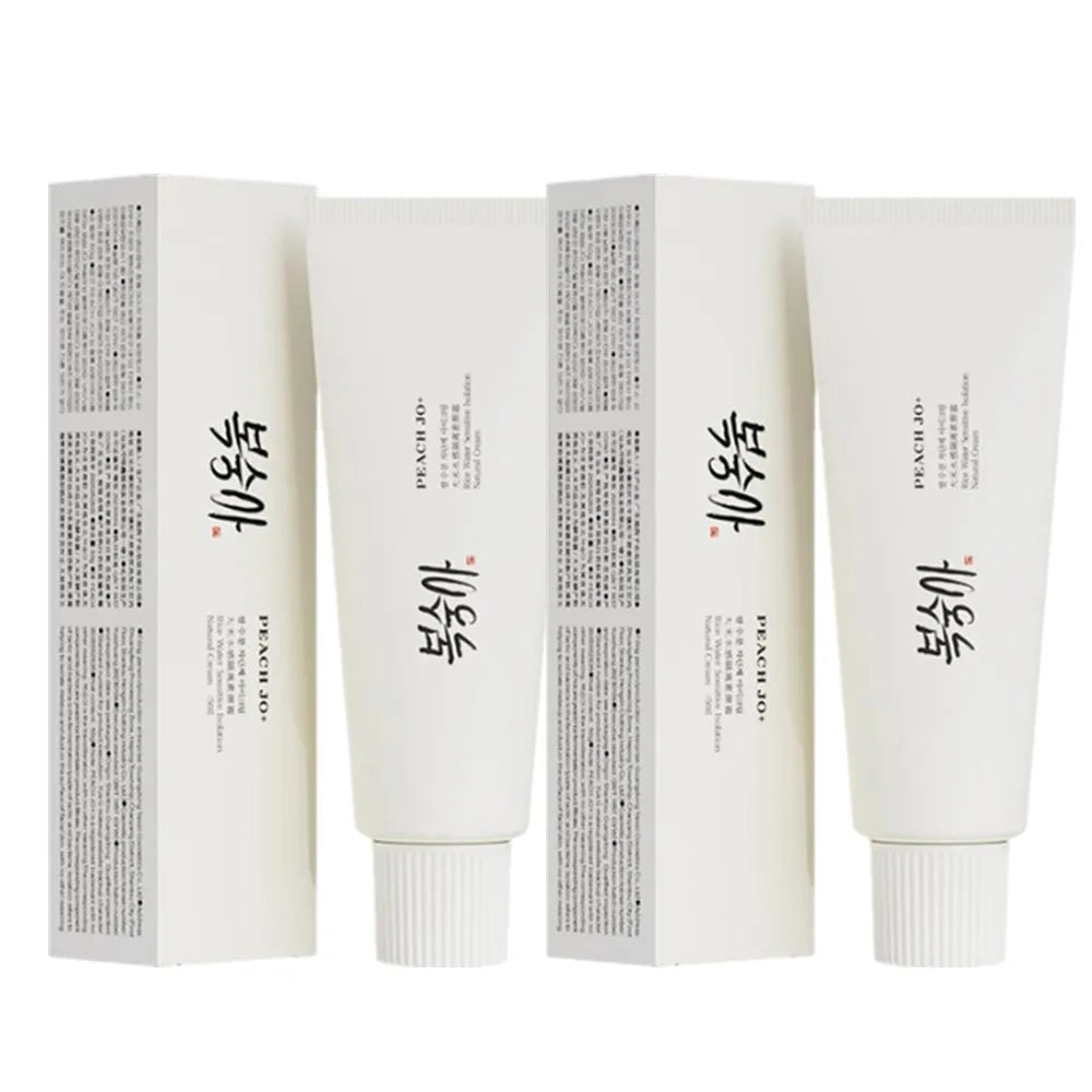 Two white SPF50+ Rice Extract Moisturizing Cream tubes and matching boxes with black text.