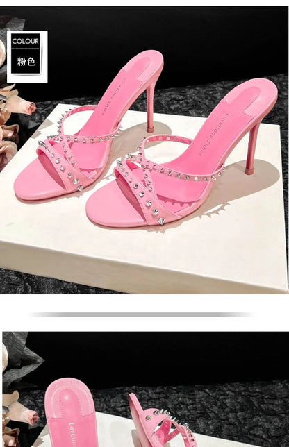Pink open toe high heel sandals with silver rivet strappy details for formal events.