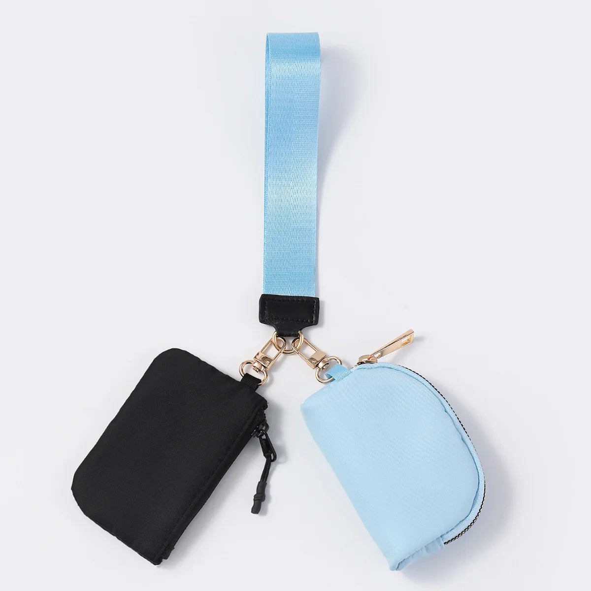 Blue and black nylon waterproof wristlet wallet with zip closure pouches for carrying daily essentials.