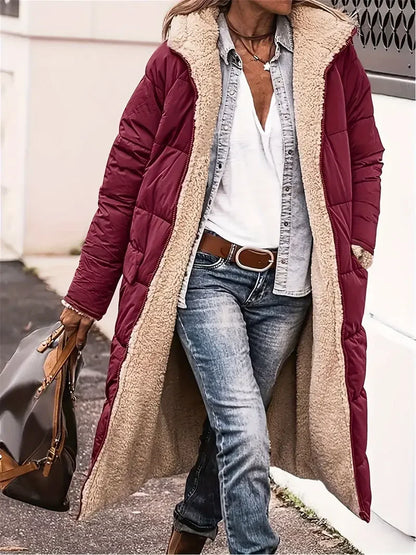 Women’s long hooded coat with zipper closure and pockets