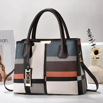 Multicolor plaid faux leather structured tote bag with zip closure for everyday use.