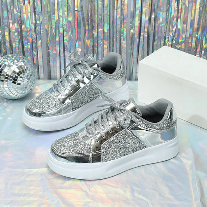 Silver sequin and metallic lace-up sneakers with thick white soles.