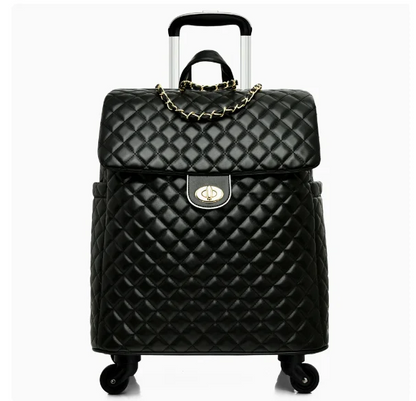 Black quilted leather rolling travel bag with gold chain strap, twist-lock closure, and retractable handle.