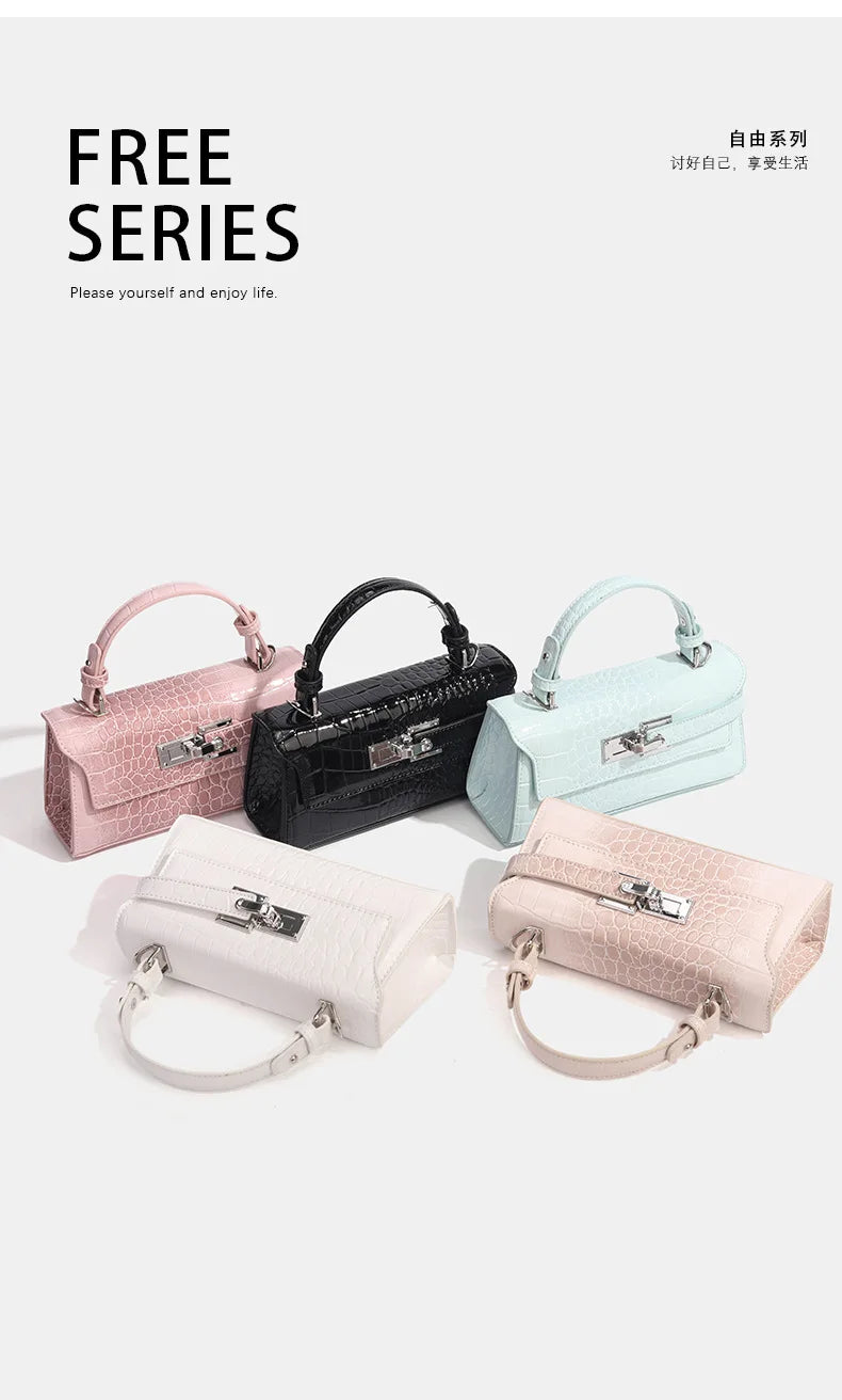 Five mini faux leather crossbody bags with croc texture, silver zip closure, and handles for everyday carry.