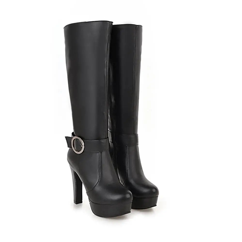 Black leather knee-high platform boots with chunky high heels and a decorative ankle strap and buckle.